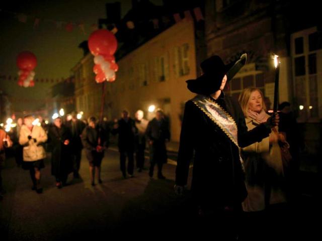 People celebrate in Beaujeu streets the traditional event of "the Sarmentelles" that starts the "Beaujolais Nouveau" 2012 edition. AFP photo
