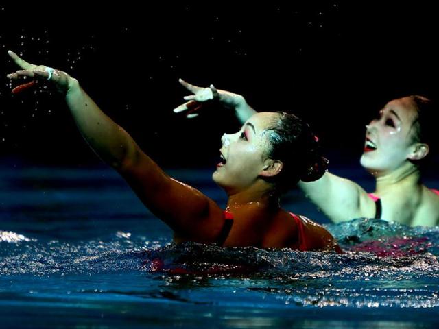 Kim Jong-Hui and Ri Ji Hyang of Democartic People's Republic of Korea perform in the Duets Free Routine Syncronised swimming final during the 9th Asian Swimming Championships in Dubai. AFP Photo