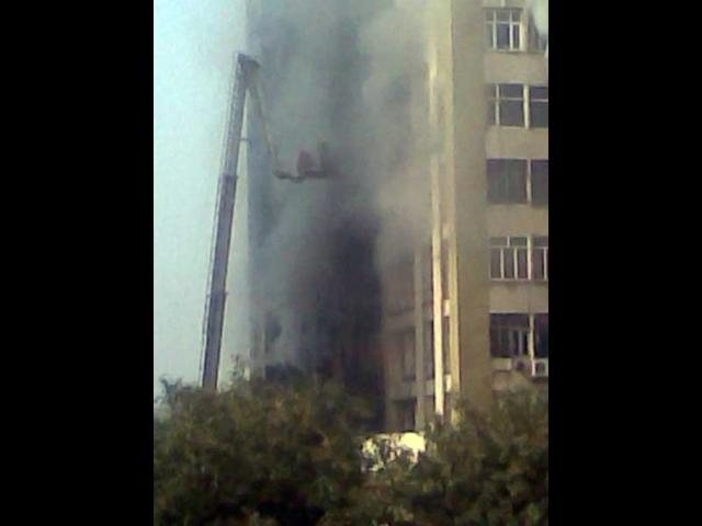 Fire fighters struggle to control the fire at Himalaya House in New Delhi's Connaught Place. HT