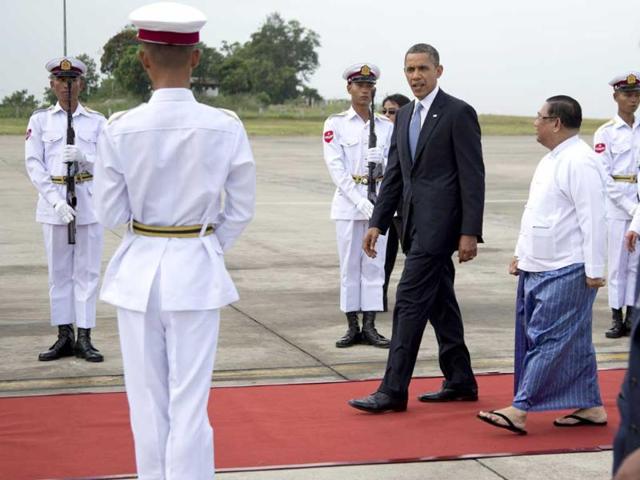 US President Barack Obama walks on a red carpet as he arrives at Yangon International Airport in Yangon, Myanmar, on Air Force One. This is the first visit to Myanmar by a sitting US president. (AP Photo/Carolyn Kaster)