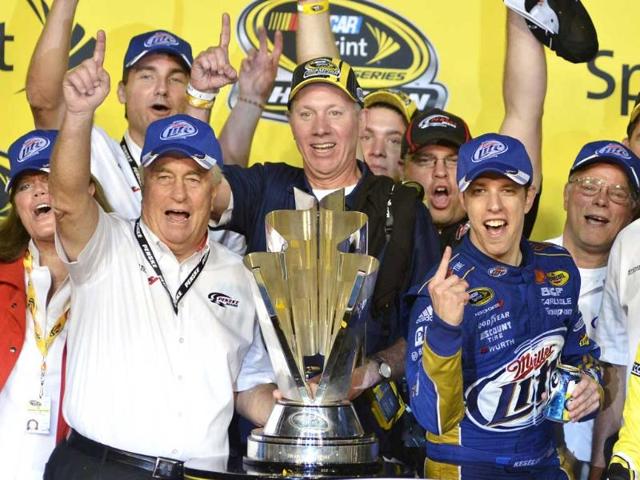 Racing legend and car owner Roger Penske (L) celebrates with his driver Brad Keselowski (R) after he won the Sprint Cup during the 2012 Ford EcoBoost 400 Sprint Cup NASCAR race at the Homestead-Miami Speedway in Homestead, Florida. REUTERS/Gaston De Cardenas