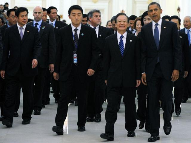 US President Barack Obama and Chinese Prime Minister Wen Jiabao attend the 7th East Asia summit-Plenary session at the Peace Palace in Phnom Penh. AFP