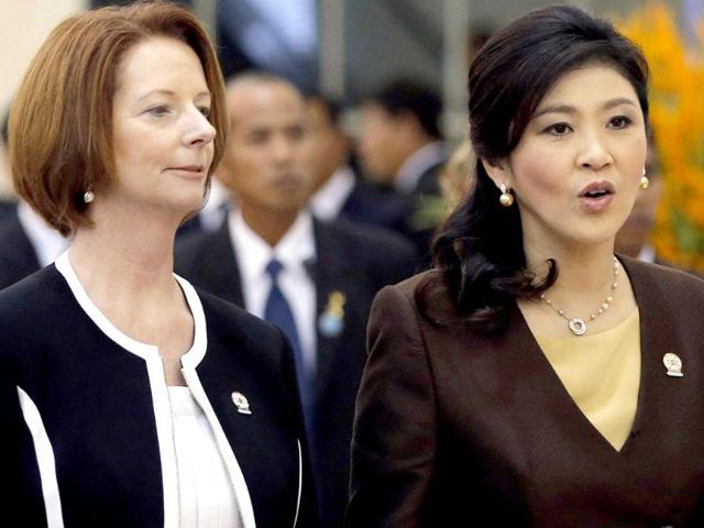 Australia's Prime Minister Julia Gillard and Thailand's Prime Minister Yingluck Shinawatra arrive for the Plenary session of the 21st ASEAN (Association of Southeast Asian Nations) and East Asia summits in Phnom Penh. Reuters