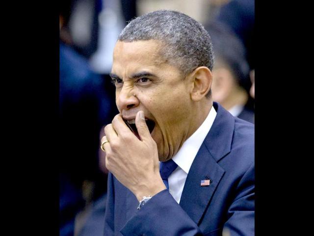 US President Barack Obama yawns at the beginning of the East Asian Summit Plenary Session at the Peace Palace in Phnom Penh, Cambodia. AP