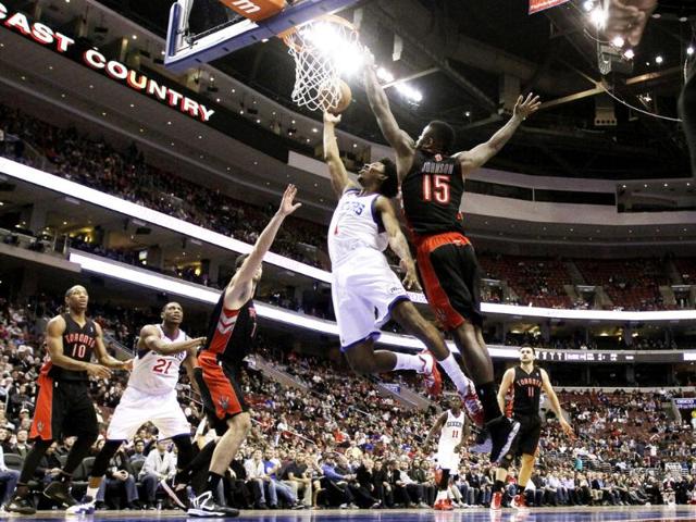 Philadelphia 76ers' Nick Young drives to the basket against Toronto Raptors' Amir Johnson in the second half of an NBA basketball game in Philadelphia. Philadelphia won 106-98. AP/Matt Slocum