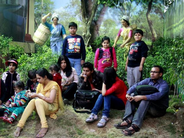 Visitors relax at the Assam pavilion, depicting a tea farm, during the 32th India International Trade Fair at Pragati maidan in New Delhi (HT Photo/Sonu Mehta)