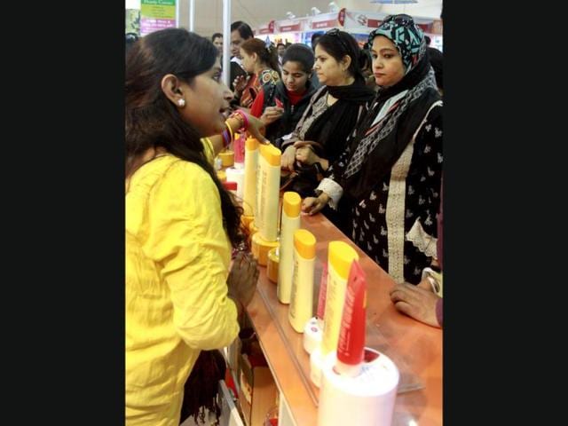 Women visit a pavilion displaying beauty products during the 32nd India International Trade Fair at Pragati maidan in New Delhi. (HT Photo/Sonu Mehta)