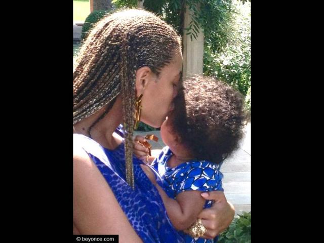 Beyoncé and Jay-Z shared snaps of their tender moments with their little girl. In this picture, you can see mommy showering all her love on baby Blue with plenty of kisses.