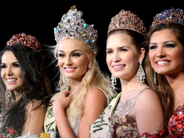 2012 Miss Earth winner Tereza Fajksova of Czech Republic (2nd L) poses with others winners Miss Fire Camila Brant (L) of Brazil, Miss Air Stephany Stefanowitz (2nd R) from Philippines, and Miss Water Osmariel Villalobos (R) from Venezuela during the coronation ceremony of the 2012 Miss Earth Competition in Manila. AFP photo
