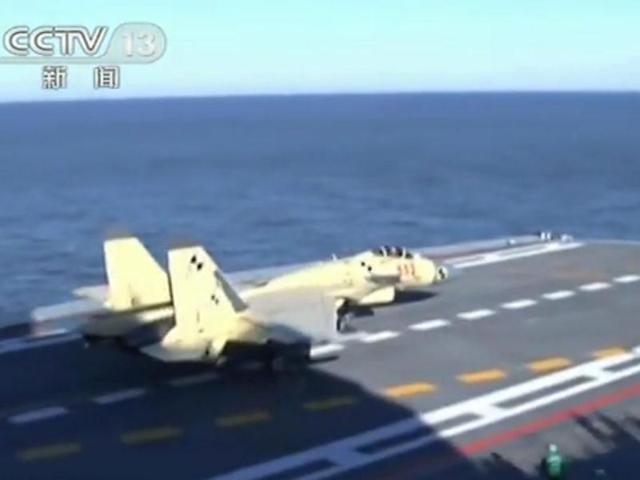 A Chinese-made J-15 fighter jet landing on the deck of the Liaoning, a former Soviet carrier, off the coast of China. AFP Photo/CCTV