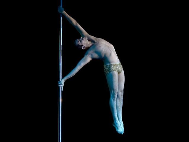 Pole dancer Felipe Mendoza of Chile competes to take second place in the Pole Dance South America 2012 competition in Buenos Aires. (AFP Photo)