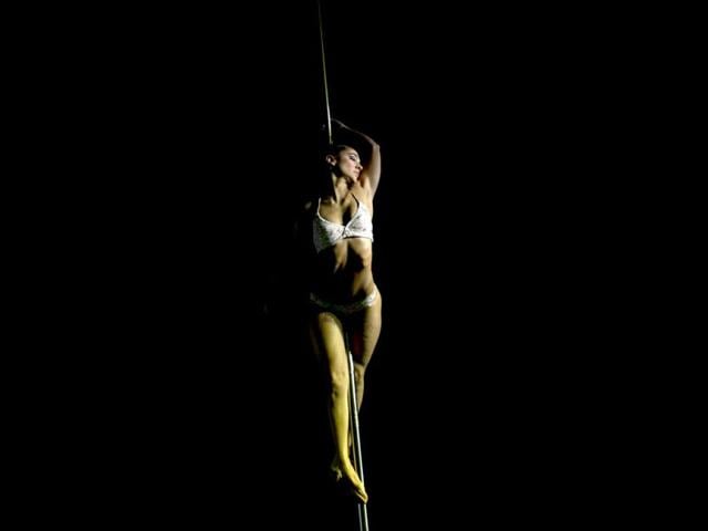 Pole dancer Micaela Garcia, of Argentina, performs her routine during the Miss Pole Dance South America 2012 and Pole Dance Argentina 2012 competitions in Buenos Aires, Argentina. (AP Photo)