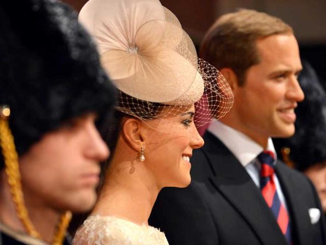 Wax figures of Britain's Catherine, Duchess of Cambridge and Prince William are displayed at a press preview in Tokyo. AFP Photo/Yoshikazu Tsuno