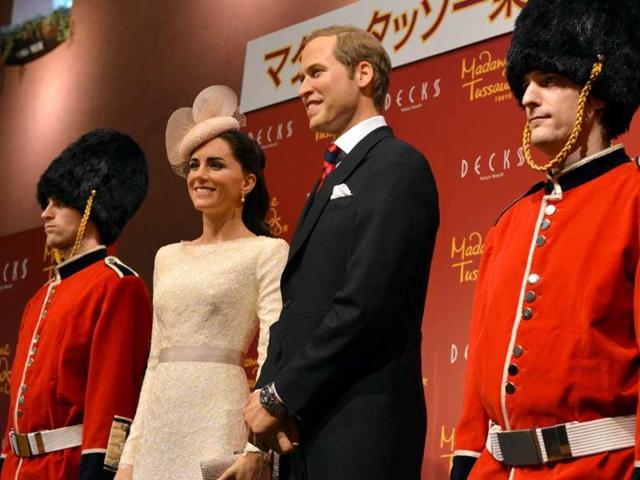 Wax figures of Britain's Catherine, Duchess of Cambridge and Prince William are displayed at a press preview in Tokyo. AFP Photo/Yoshikazu Tsuno