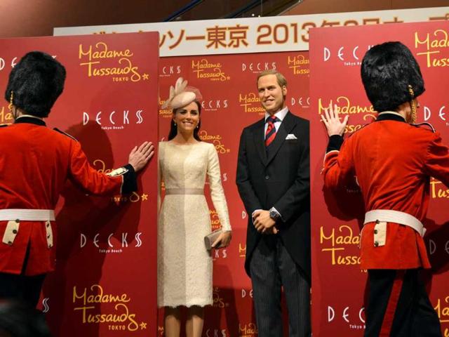 Wax figures of Britain's Catherine, Duchess of Cambridge and Prince William are unveiled at a press preview in Tokyo. AFP Photo/Yoshikazu Tsuno
