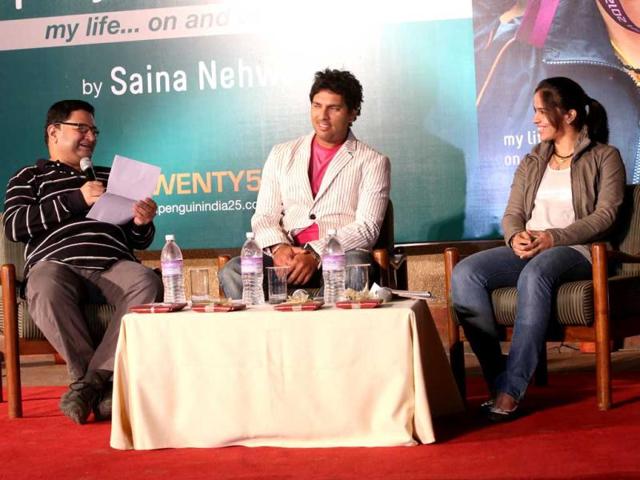 Yuvraj and Saina share a joke during the discussion of Saina's book launch in Delhi on Wednesday.