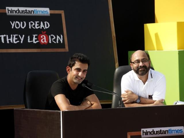 Cricketer Gautam Gambhir along with Shantanu Bhanja during a Hindustan Times initiative 'You Read They Learn' programe at Pratham centre at Trilokpuri in New Delhi. HT/Virendra Singh Gosain