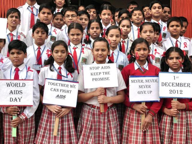 School children holding placards during a campaign against AIDS in Bikaner, ahead of World AIDS Day. PTI