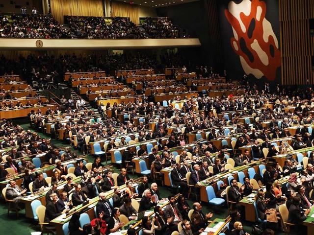 Members of the UN General Assembly applaud after voting in favor of a UN resolution on Palestine in New York City. AFP