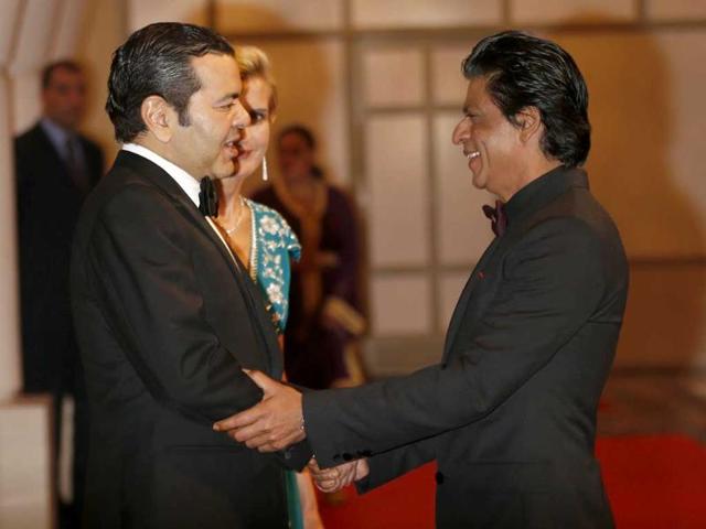 Morocco's Prince Mouley Rachid (L) shakes hands with Shahrukh Khan (R) during the 12th Marrakech International Film Festival in Marrakech. AFP
