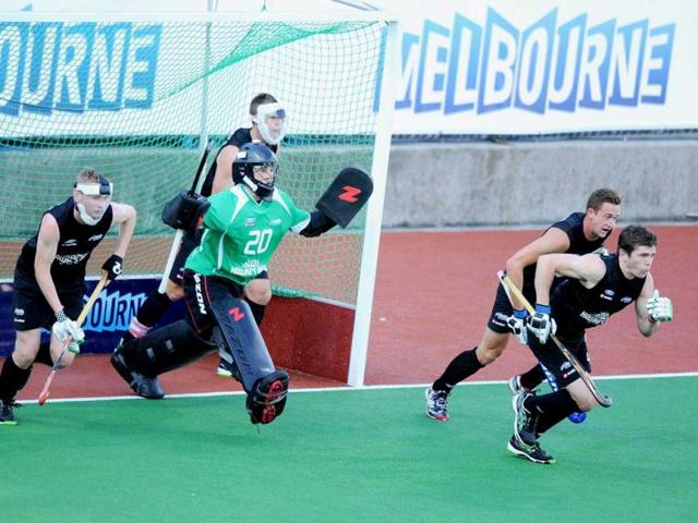New Zealand players rush out of the goal to defend a penalty corner during their Pool A match against India at the Men's Hockey Championships Trophy in Melbourne. (AFP Photo)