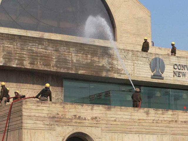 Fire Brigade personnel during a mock drill as part of Delhi Emergency Management Exercise (DEMEX) at NDMC Building in New Delhi. PTI Photo