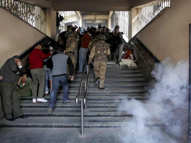 Volunteers and paramilitary personnel run as a firecracker is set off to simulate the scene of a bomb explosion in a metro station during a mock drill in New Delhi. AP Photo