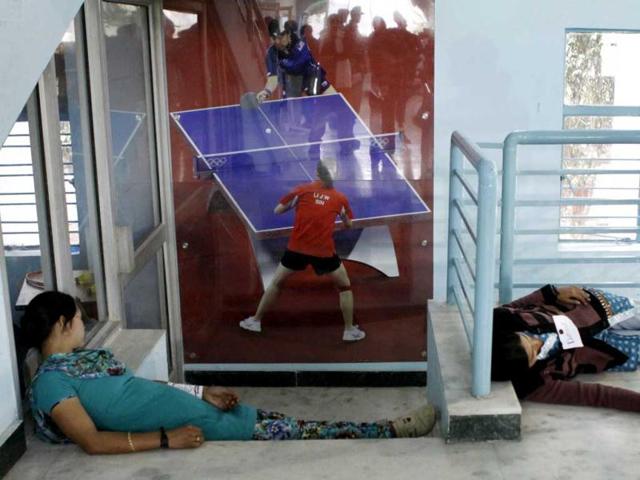 A woman pretends to be dead during a mock drill session held at Birla Vidya Niketan, New Delhi. HT/Sunil Saxena