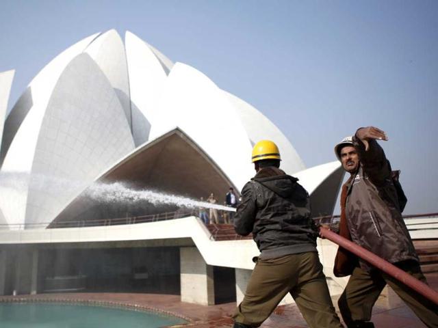 A fire fighter participating in a mock drill in Lotus Temple in New Delhi. HT/M Zhazo