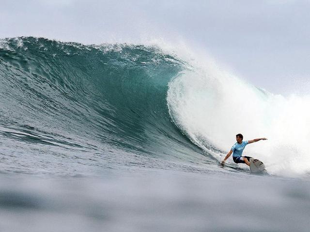 Jesse Mendes, of Brazil, competes on his way to a fifth place overall finish in the Vans World Cup of Surfing at Sunset Beach near Haleiwa, Hawaii. AP/Association of Surfing Professionals, Kelly Cestari
