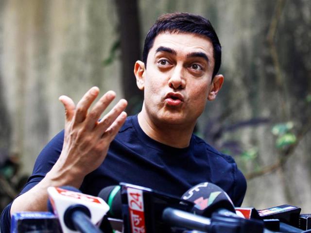 Aamir Khan has an amused look as he talks to the media during Talaash promotions at his residence.