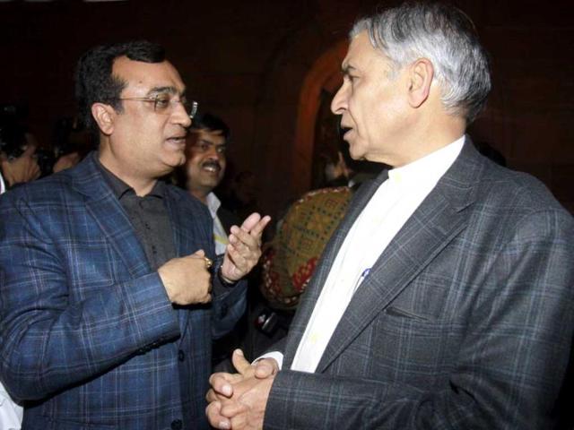 Union minister of Housing and poverty alleviation Ajay Maken, and Union railway minister Pawan Kumar Bansal leave Parliament House after winning a vote on foreign direct investment in Lok Sabha (HT Photo/Sonu Mehta)