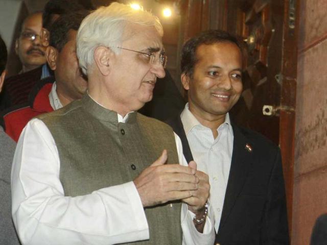 Minister of external affairs Salman Khurshid and Congress MP Naveen Jindal leave Parliament after winning a vote on foreign direct investment. (HT Photo/Sonu Mehta)