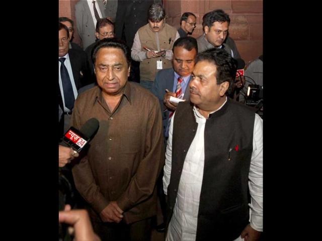 Ministers leave after voting on FDI in Lok Sabha during the winter session of Parliament, New Delhi (PTI Photo)