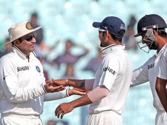 Virender Sehwag, Virat Kohli and Cheteshwar Pujara celebrate the dismissal of England's James Anderson during Day 4 of the 3rd Test Match at Eden Garden in Kolkata. PTI Photo