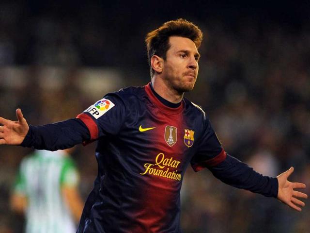 Barcelona's Argentinian forward Lionel Messi celebrates after scoring during the Spanish league football match Real Betis vs FC Barcelona at the Benito Villamarin stadium in Sevilla. AFP Photo