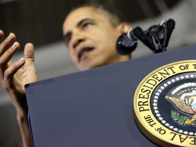 President Barack Obama gestures as he speaks about the economy to an audience comprised of workers and guests during a visit to the Daimler Detroit Diesel plant in Redford, Michigan. AP Photo