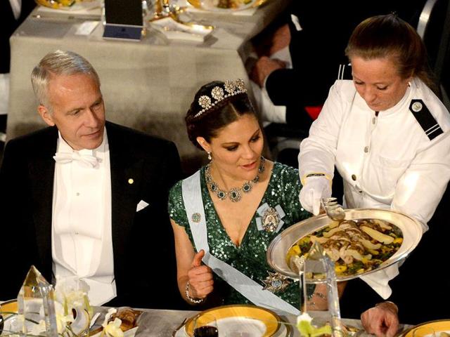 The 2012 Nobel Chemistry Prize winner Brian K Kobilka (L) and Princess Victoria of Sweden (R) attend the Nobel Banquet, a traditional dinner after the Nobel Prize awarding ceremony at the Stockholm City Hall. AFP PHOTO/JONATHAN NACKSTRAND