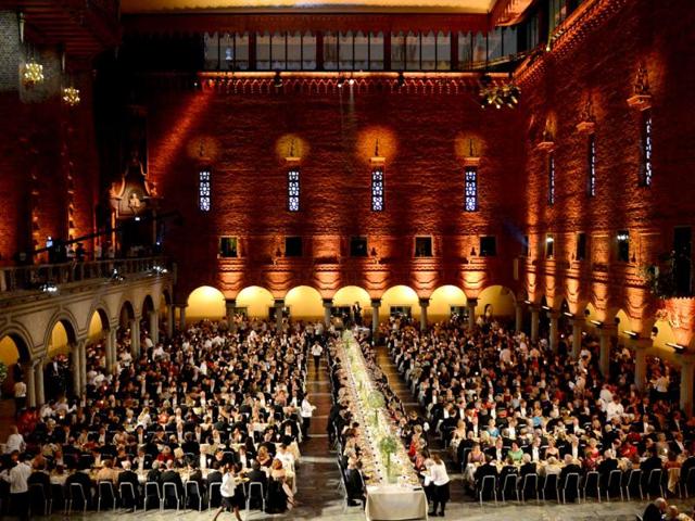 An overview of the Nobel banquet is pictured, a traditional dinner after the Nobel Prize awarding ceremony at the Stockholm City Hall. The winners of the Nobel Prize 2012 in the categories of medicine, physics, chemistry, literature and economics received their awards from the hands of Sweden's King Carl XVI Gustaf at a formal ceremony, followed by a gala banquet. AFP PHOTO/JONATHAN NACKSTRAND