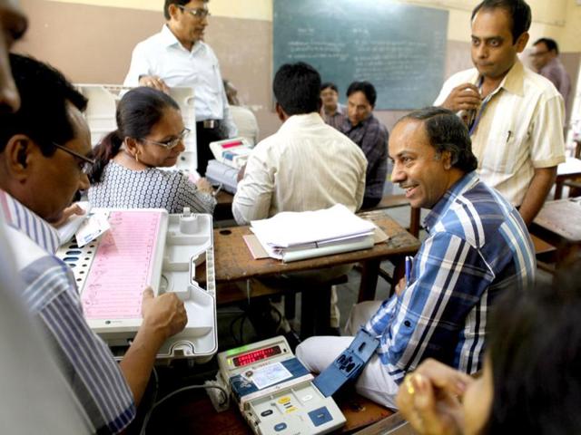 Election monitors check Electronic Voting Machines at a distribution centre in Surat, Gujarat (HT Photo/Satish Bate)