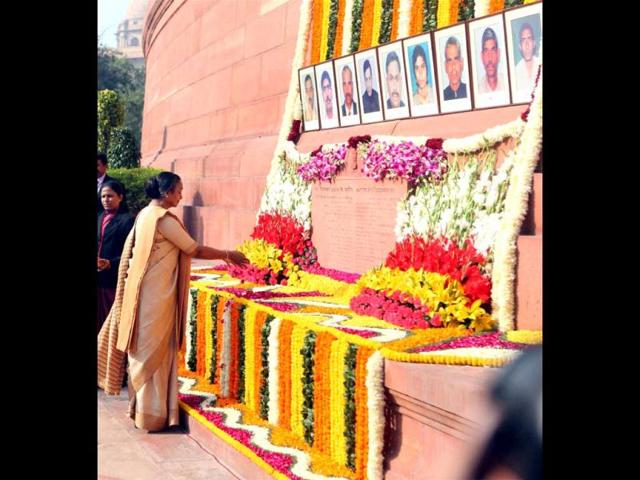Lok Sabha speaker Meira Kumar pays tribute to the martyrs of the 2001 Parliament attack on its 11th anniversary, at Parliament House in New Delhi. (PTI Photo)