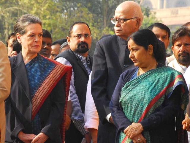 UPA chairperson Sonia Gandhi, Opposition leader Sushma Swaraj after paying tribute to martyrs of the Parliament attack on its 11th anniversary in New Delhi. (UNI Photo)