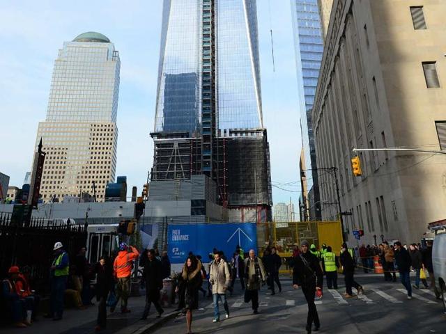 One-World-Trade-Center-stands-in-construction-as-the-first-of-18-segment-of-a-spire-crowning-it-was-hoisted-into-place-in-New-York-December-12-2012-Photo-AFP-Emmanuel-Dunand