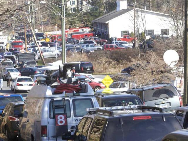 The scene at Sandy Hook Elementary School in Newtown, Connecticut. A shooter opened fire at the elementary school in Newtown, Connecticut. REUTERS/Michelle McLoughlin (UNITED STATES - Tags: CRIME LAW EDUCATION