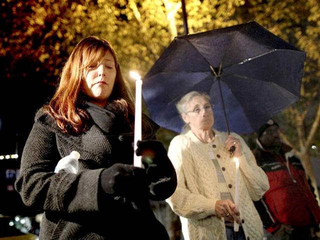 Denise Johnson and her mother Doreen Finsinger hold candles during a candlelight vigil in memory of those killed in a mass shooting at Sandy Hook Elementary School in Connecticut, in Los Angeles. Reuters