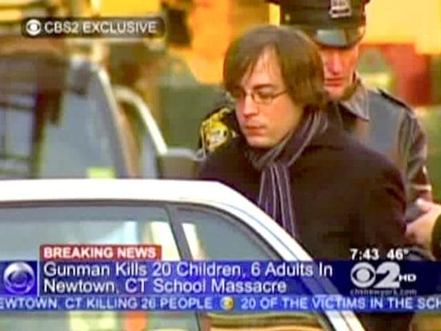 Ryan-Lanza-the-brother-of-Sandy-Hook-Elementary-School-shooter-Adam-Lanza-is-escorted-into-a-cruiser-in-Hoboken-New-Jersey-AP-Photo-WCBS-TV Ryan-Lanza-the-brother-of-Sandy-Hook-Elementary-School-shooter-Adam-Lanza-is-escorted-into-a-cruiser-in-Hoboken-New-Jersey-AP-Photo-WCBS-TV