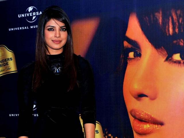 Bollywood diva Priyanka Chopra stuns in a short black dress as she attends a press conference for Blender's Pride Fashion Tour in Mumbai on December 14. Check out the curvacious actress at the event! (AFP Photo)