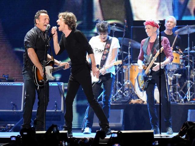 Musician Bruce Springsteen, left, performs with Mick Jagger, Ronnie Wood, Keith Richards and Charlie Watts during the Rolling Stones final concert of their "50 and Counting Tour" in Newark, New Jersey. (AP Photo)