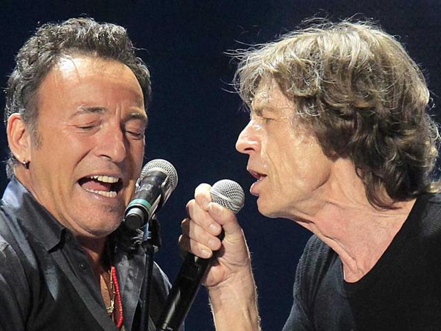 Mick Jagger(R) and Bruce Springsteen perform onstage during the Rolling Stones final concert of their "50 and Counting Tour" in Newark, New Jersey. (Reuters)