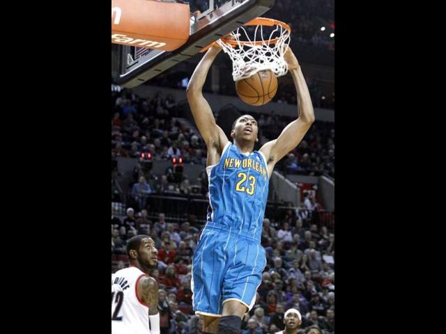 New Orleans Hornets forward Anthony Davis, right, scores as Portland Trail Blazers forward LaMarcus Aldridge watches during the first quarter of an NBA basketball game in Portland, Oregon. AP Photo